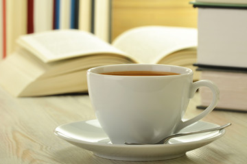 Books and cup of coffee on the table