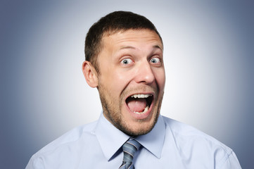 Portrait of a cheerful businessman funny expression