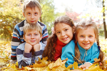 Girls and boys in autumnal park