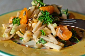 Kohlrabi salad on white wooden table
