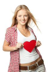 Young blond female holding heart shape