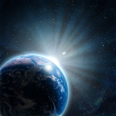 blue earth in space with rising sun