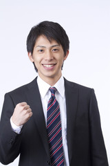 ガッツポーズの新人ビジネスマン