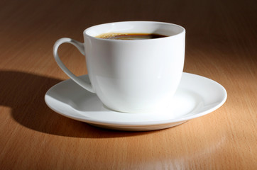 Coffee cup on woods