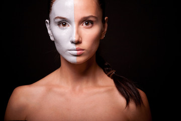 Vogue style portrait of a woman with white makeup
