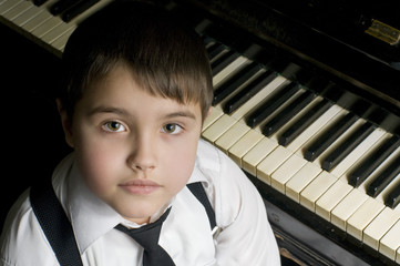Little boy and piano.
