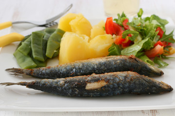sardines with boiled potato and salad