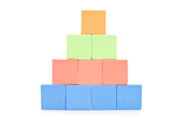 Obraz premium Foam Blocks in Shape of a Pyramid Against White Background