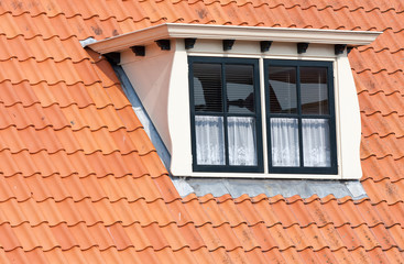 Typical Dutch roof with dormer and squared windows