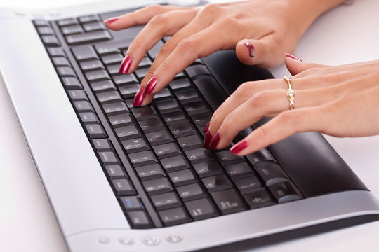 woman hands working on computer keyboard