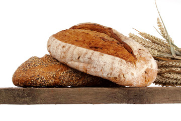 Bread loaf and buns on a shelf