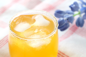 Orange cocktail with flower