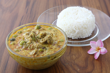 Thai food beef curry with rice in wood background
