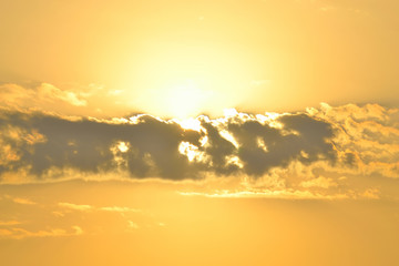 Sun behind the cloud
