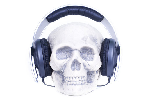 Human skull with music headphones.