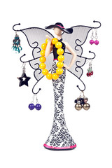 statuette woman with wings hung with jeweled
