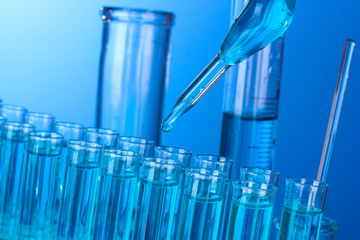Test-tubes on blue background