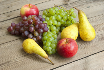 apples grapes and pears, wooden table