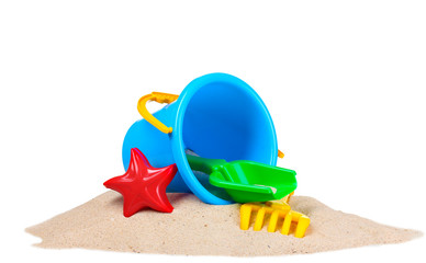 Fototapeta na wymiar children's beach toys and sand isolated on white