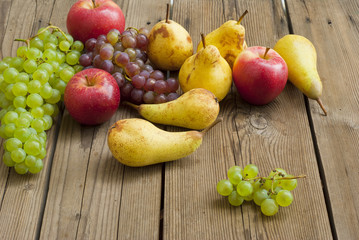 apples grapes and pears, wooden table