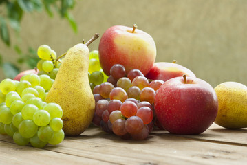 apples grapes and pears, wooden table