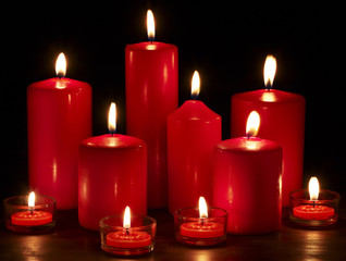Group of  candles on  black background.
