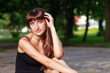 Caucasian long hair girl`s  portrait at park.