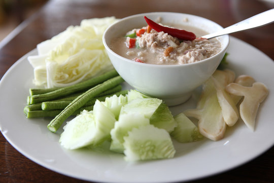 Thai food soya bean dipping sauce in pork with vegetable on woo