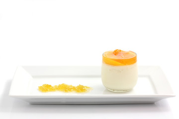 Orange panna cotta isolated in white background