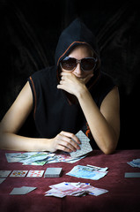 Poker face. Person playing poker