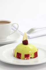Fruit dome cake with coffee isolated in white background