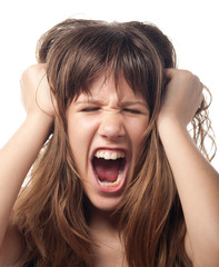 Angry and frustrated teenage girl screaming.
