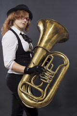 Portrait of girl in a suit with musical instrument