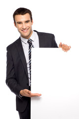 Businessman holding blank poster