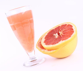 Freshly squeezed out Grapefruit juice, and a sliced Grapefruit
