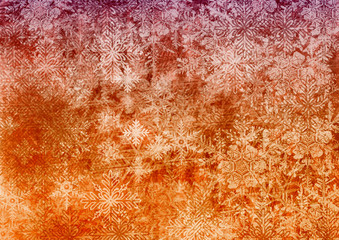 An abstract textured background with a gradient from deep purple to bright orange and yellow, featuring large snowflake patterns that create depth and a vintage holiday feel.