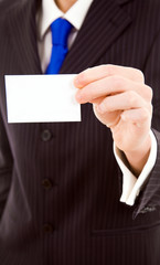 Hand of businessman showing business card