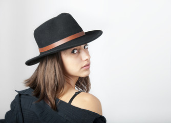 Portrait of the beautiful teenage girl with cowboy hat