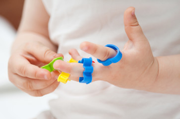 Baby's hands with toys