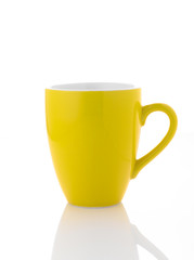 Yellow coffee cup on white background