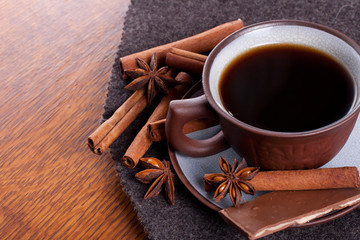 Coffee and chocolate on the wood background
