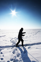 Ski track on snow field in beautiful sunny day