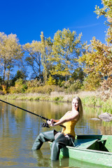 fishing woman sitting on boat