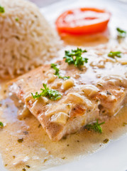 grilled salmon and rice-french cuisine dish with tomato and salm