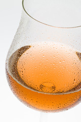 wineglass with rosé wine