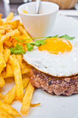 classical english breakfast with egg and fries