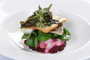 Pan-fried sea bass with beetroot and potato salad