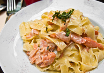 close-up of plate of pasta and smoked salmon