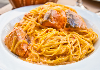 close-up of plate of pasta and smoked salmon