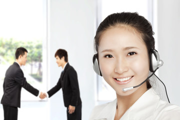 Smiling businesswoman  customer service on the phone